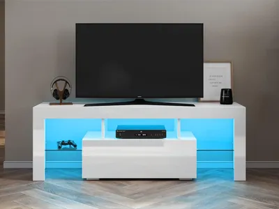 A white TV stand with LED lighting and a television on top.