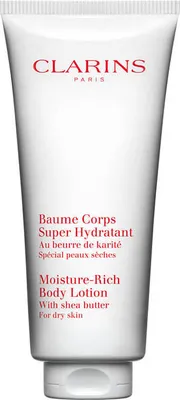 A white tube of Clarins body lotion is shown against a white background.