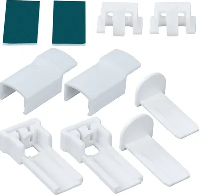 A collection of white plastic mounting hardware and two teal adhesive pads, likely for window blinds or similar fixtures.