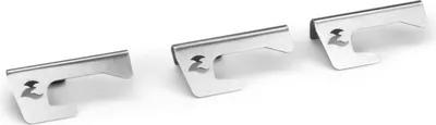Three metal spacers are arranged diagonally on a white background.