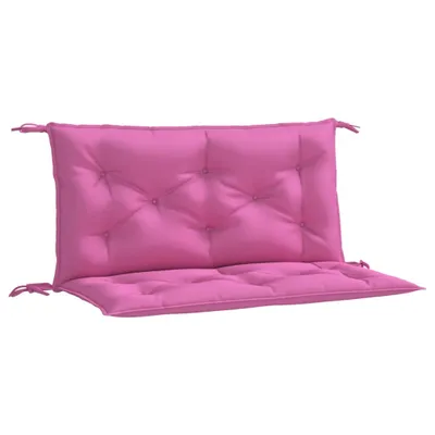 A pink cushion for a garden bench.