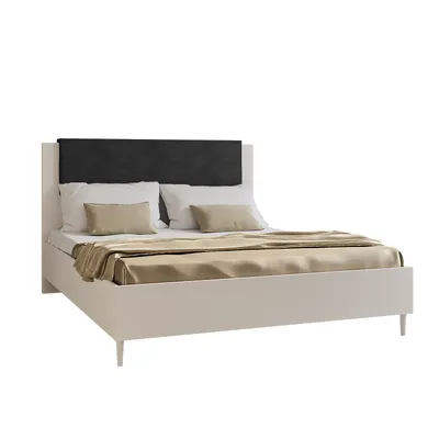A white bed with a black headboard and beige bedding, shown against a white background.
