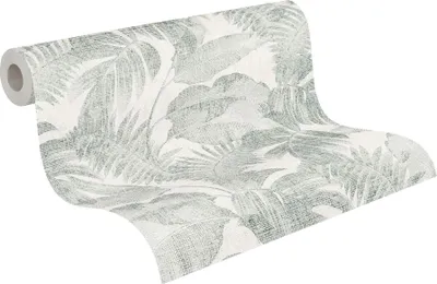 A roll of wallpaper with a tropical leaf pattern.