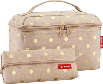 A beige cosmetic bag with gold polka dots and a matching smaller pouch.