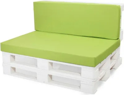 A white pallet sofa with green cushions.