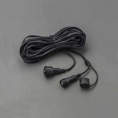 A black extension cord coiled on a gray background.