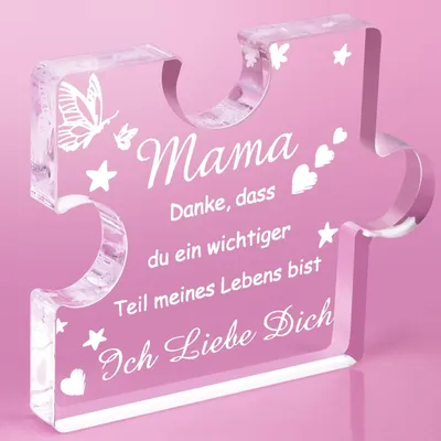 A clear acrylic puzzle-shaped decoration with text and graphics.