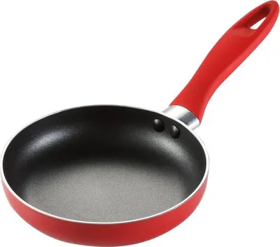 A red and black frying pan with a red handle, isolated on a white background.