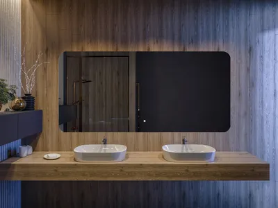 A modern bathroom vanity with two sinks and a large illuminated mirror.
