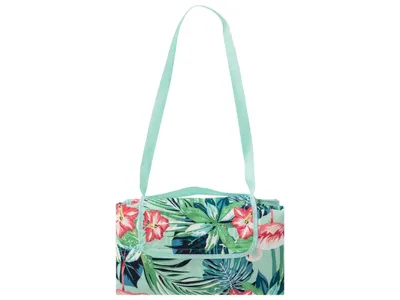 A folded picnic blanket with a tropical pattern and a mint green strap, displayed against a white background.