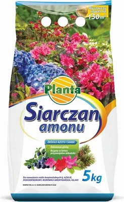 A bag of fertilizer with images of flowers and berries.