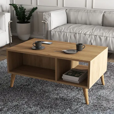 A modern living room scene with a coffee table, sofa, and armchair.
