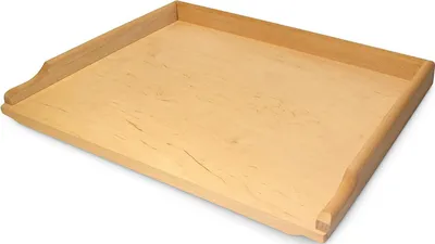 A wooden pastry board with raised edges, shown from a slightly elevated angle against a white background.