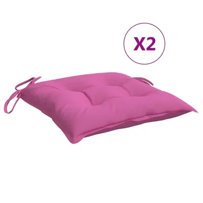 A pink cushion with ties, shown on a white background.