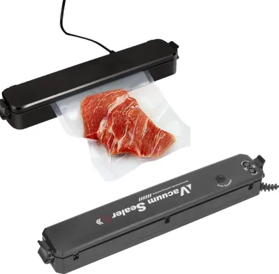 Two vacuum sealers are shown against a white background. One is actively sealing a piece of raw meat in a plastic bag. The other is closed and shows the brand name.