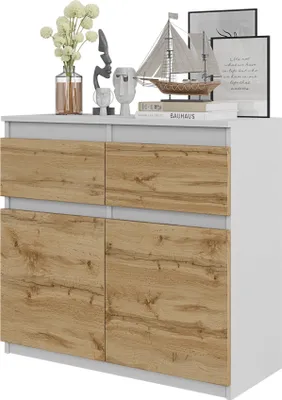 A white and wood-grain sideboard with decorative items on top.