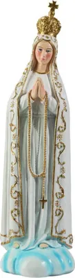 A statue of the Virgin Mary wearing a crown and holding a rosary, standing on a cloud.