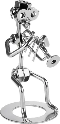 A metal figurine of a musician playing a trumpet, made from nuts, bolts, and other hardware.