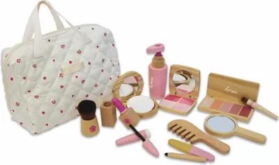 A collection of wooden toy makeup items and a quilted cosmetic bag.