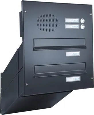 A black intercom and mailbox unit mounted on a wall.