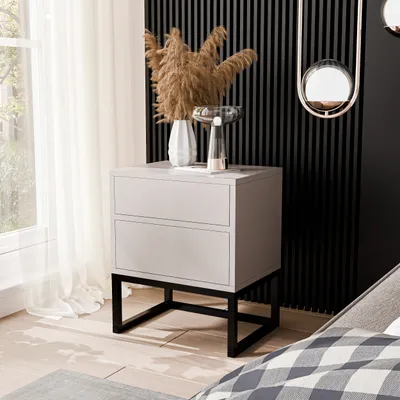 A modern bedroom setting with a nightstand next to a window and bed.