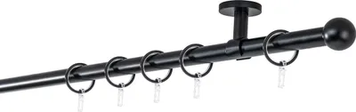A black curtain rod with rings attached, mounted to a ceiling.