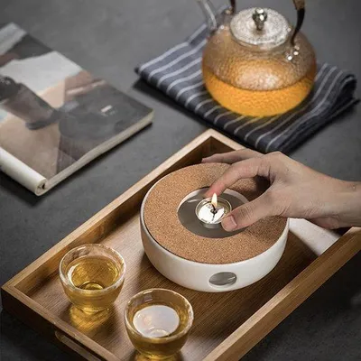 Produktbild von Unyqoos® Keramik-Teekannenwärmer mit Korkhalter, rutschfeste Eichenunterlage – Teewärmer für Tee, Kaffee & Milch, Retro-Hohl-Design (ohne Kerze & Kanne)