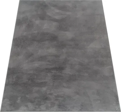 A gray rug is shown from a slightly elevated angle against a white background.