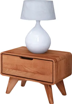 A white lamp sits on a wooden nightstand with a single drawer.