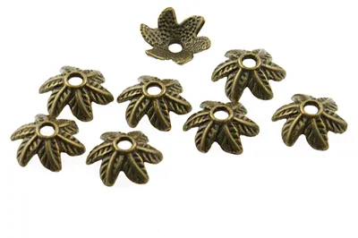 Produktbild von Vintageparts Perlkappen Blätter antik Bronze, 20 Stück, 10 mm