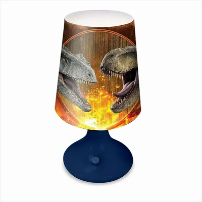 A dinosaur-themed table lamp with a blue base and a lampshade featuring two roaring dinosaurs.