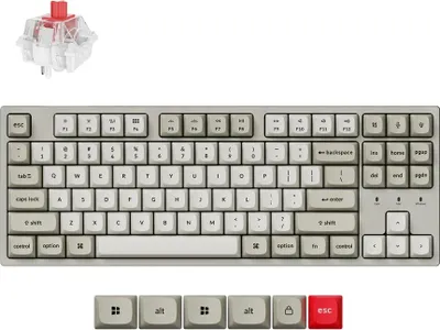 A collage of a mechanical keyboard, a keyboard switch, and individual keycaps.