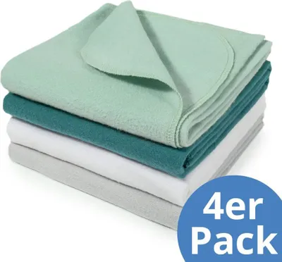 A stack of four folded blankets in different colors.