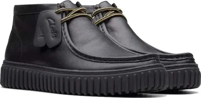 A pair of black Clarks Torhill Hi leather boots on a white background.