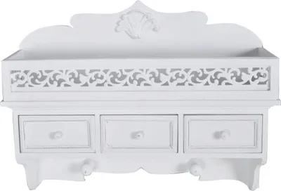 A white wooden wall-mounted shelf with three drawers and decorative carvings.