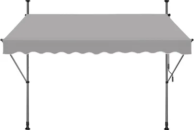 A gray awning with a scalloped edge is supported by metal poles.