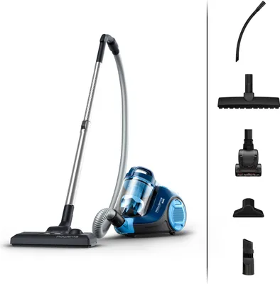 A blue and gray bagless vacuum cleaner with various attachments displayed on the right side of the image against a white background.