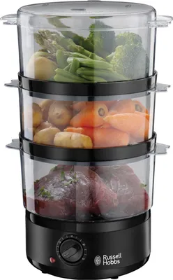 A Russell Hobbs compact steamer with three transparent tiers filled with food, placed on a white background.