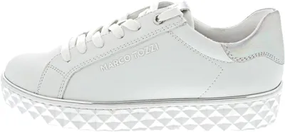 A side view of a white sneaker with a distinctive platform sole.