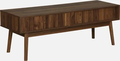 A dark wood TV stand with a slatted front and angled legs, presented on a white background.