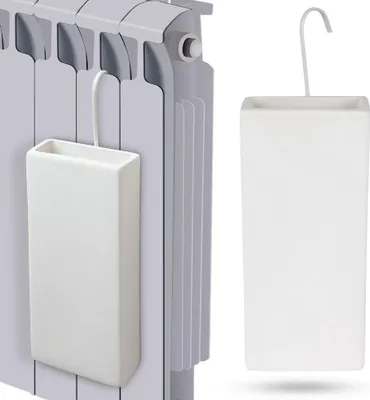 A white ceramic humidifier designed to hang on a radiator, shown both attached to a radiator and on its own.