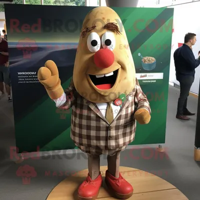 Immagine prodotto di Personaggio in costume mascotte REDBROKOLY Olive Currywurst vestito con una camicia di flanella e fermacravatta