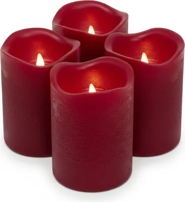 A set of four dark red LED candles with flickering flames.