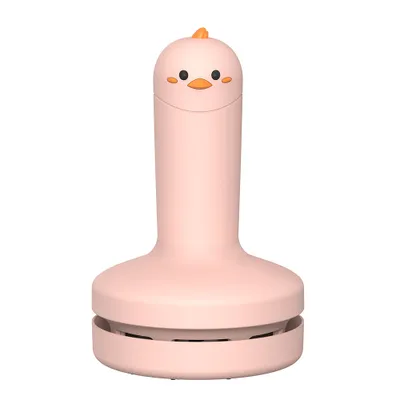 A pink chick-shaped mini desk vacuum cleaner is shown against a white background.