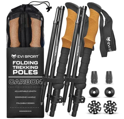 A set of four trekking poles with cork handles, along with accessories, displayed against a white background.