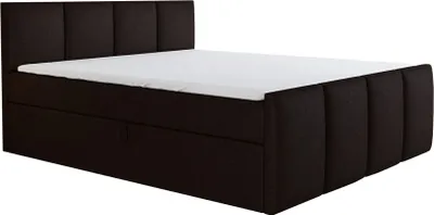 A dark brown upholstered bed with a white mattress.