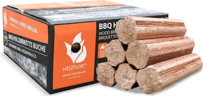 A box of BBQ wood briquettes with some briquettes stacked in front of it.