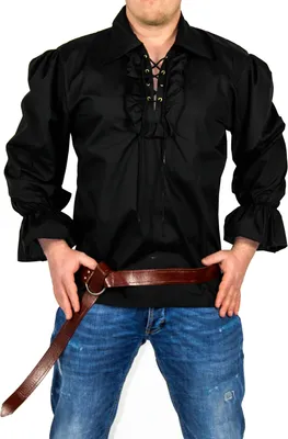 A person wearing a black pirate shirt and blue jeans, with a brown belt.