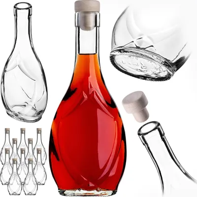 A collection of clear glass bottles with cork stoppers, some filled with amber liquid, arranged against a white background.