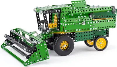 A model of a green and black harvester made from construction toy parts.